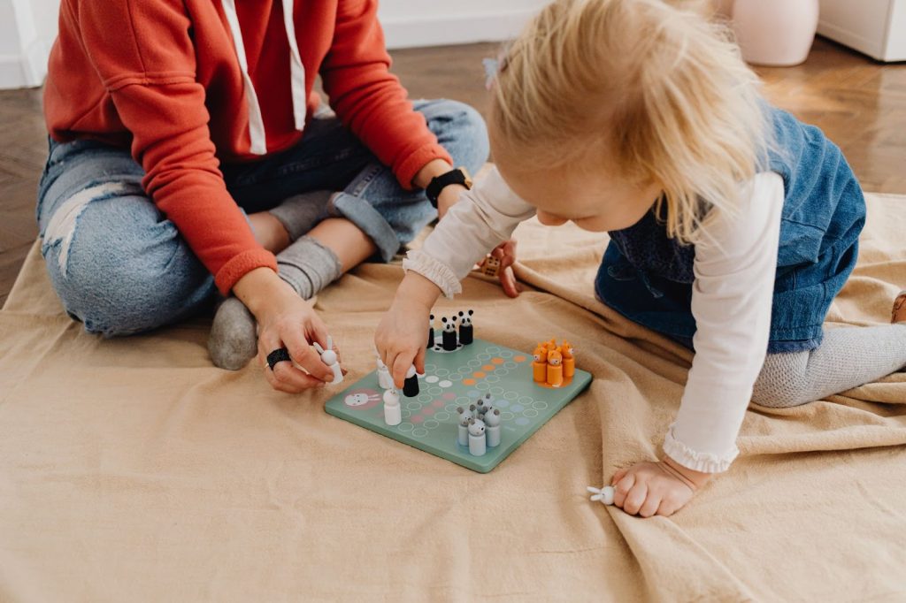 Two kids playing a board game