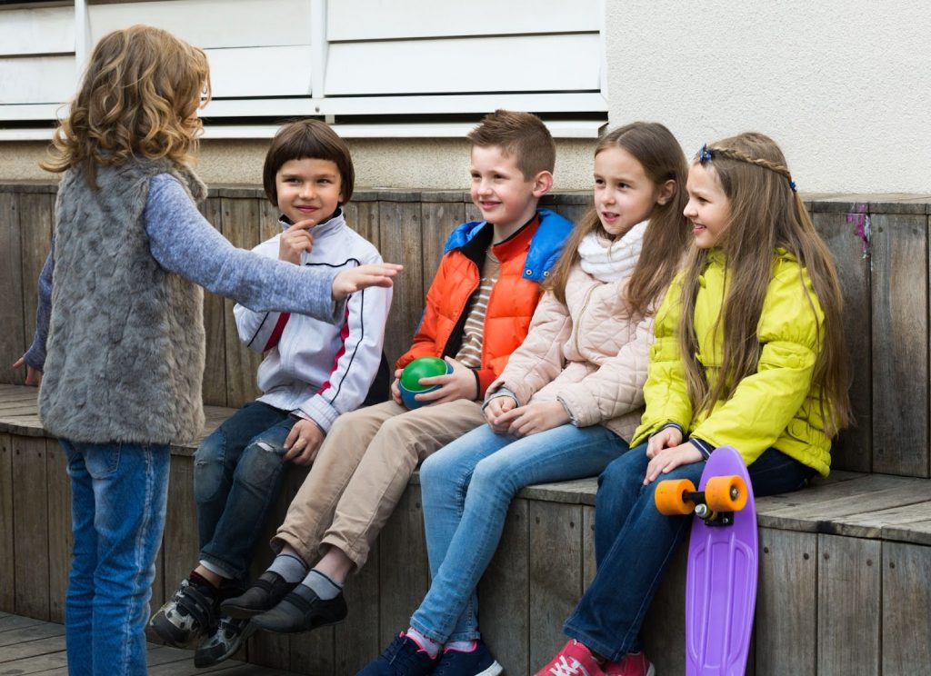 Kids trying to guess what their is showing with hand gestures