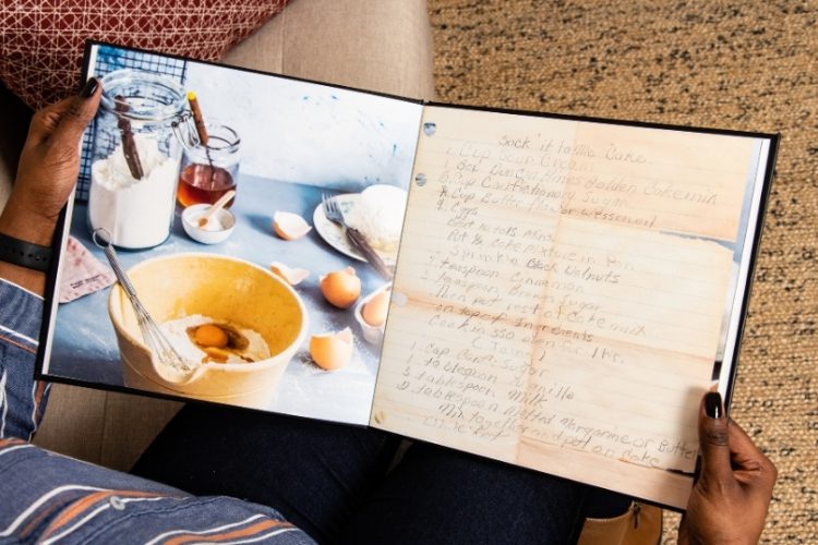 A person holding a DIY recipe book