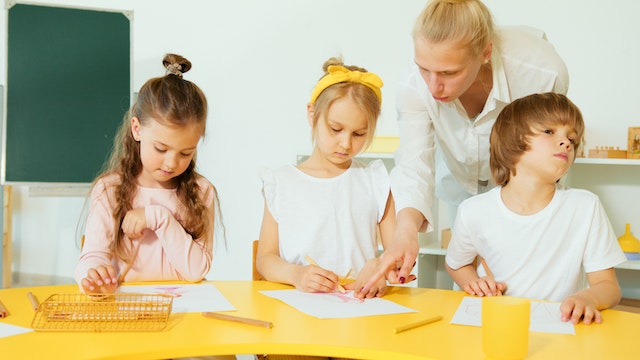 Kids completing writing prompt in school