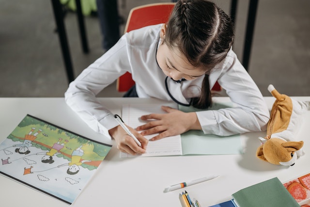 Child working on fiction themed writing prompt