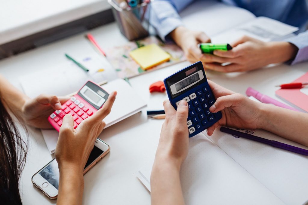 Three Kids Solving Using Calculators