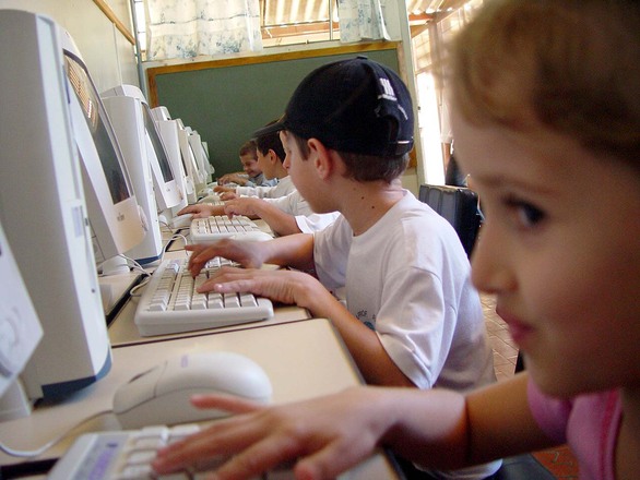 Children using PC with enthusiasm
