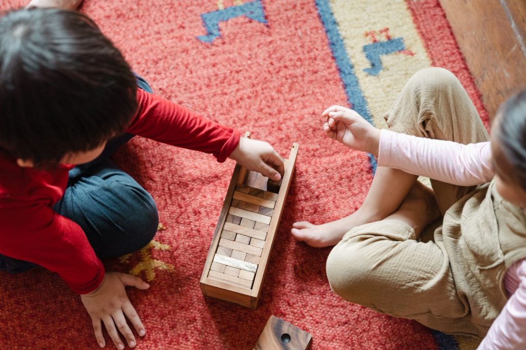 Two kids playing Jenga