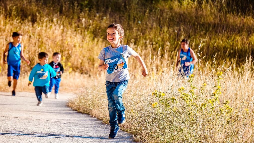 Boys running on the pathway