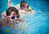 Kids Swimming during Daytime