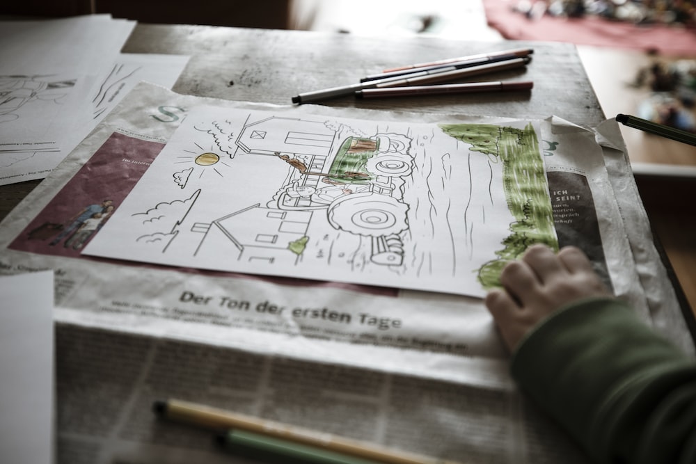 A kid sketching on A4 paper