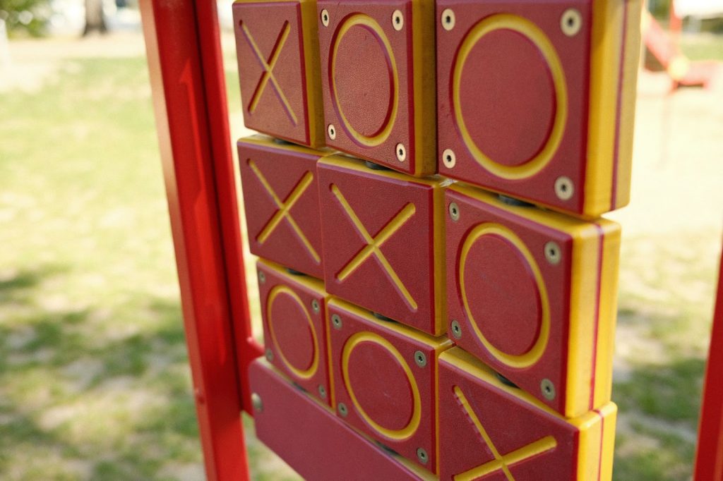 A board with tic tac toe game on it