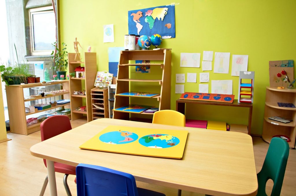 A vibrant kids classroom with wooden furniture