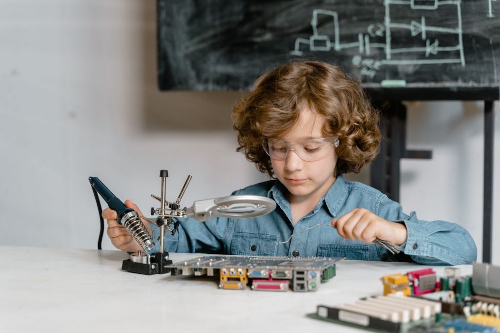 Young boy doing doing science experiment