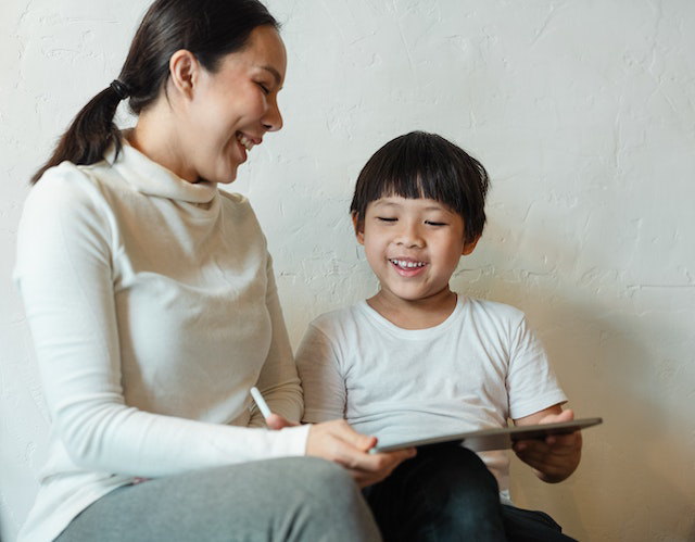 Child using technology for homeschool lesson