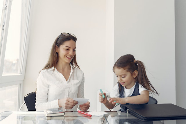 Daughter and mother in homeschool session