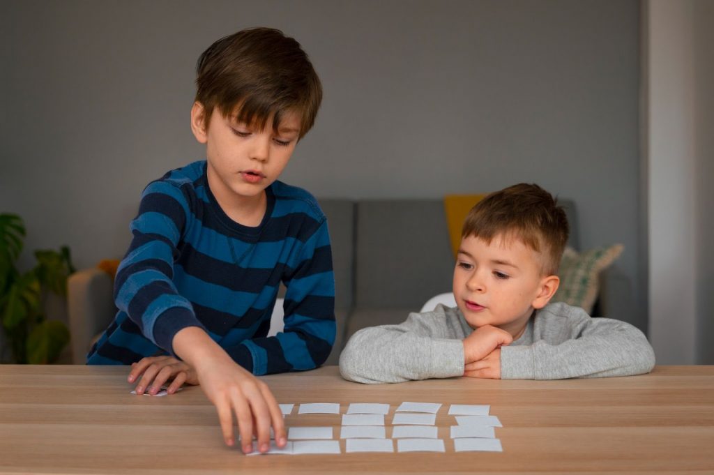 Two kids playing a memory game