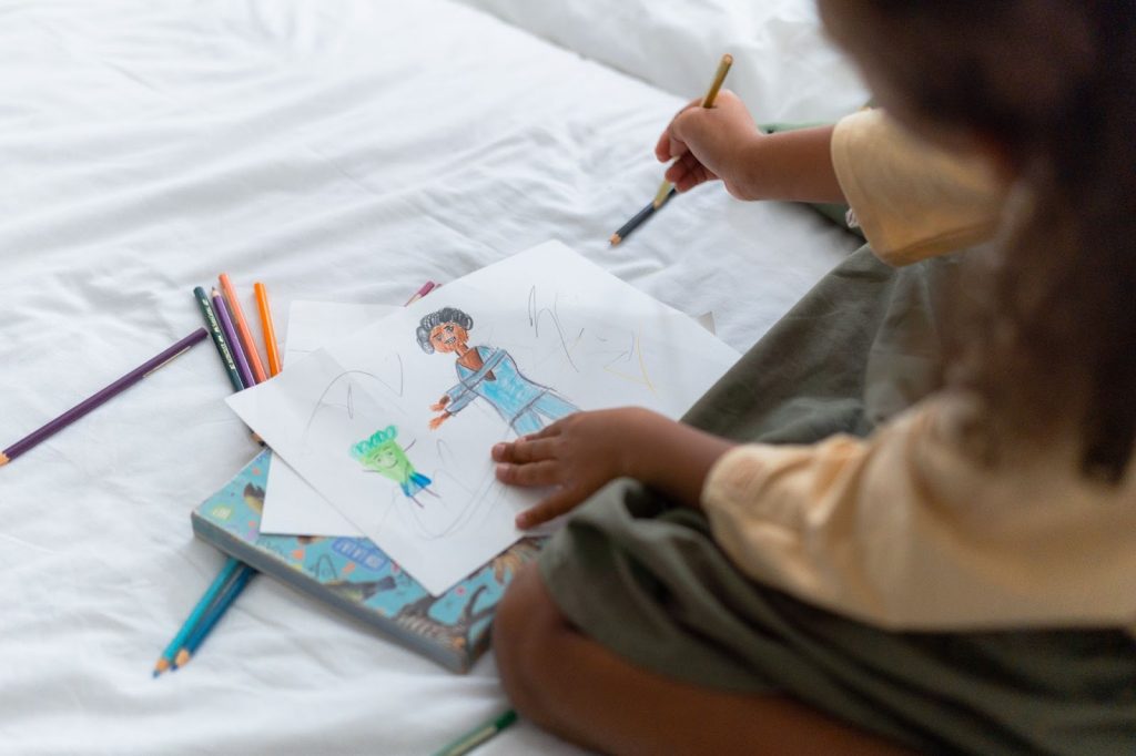 Girl Drawing on White Paper