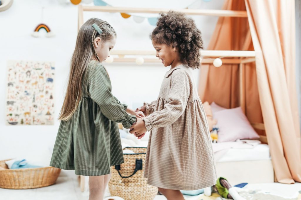 Two girls holding hands