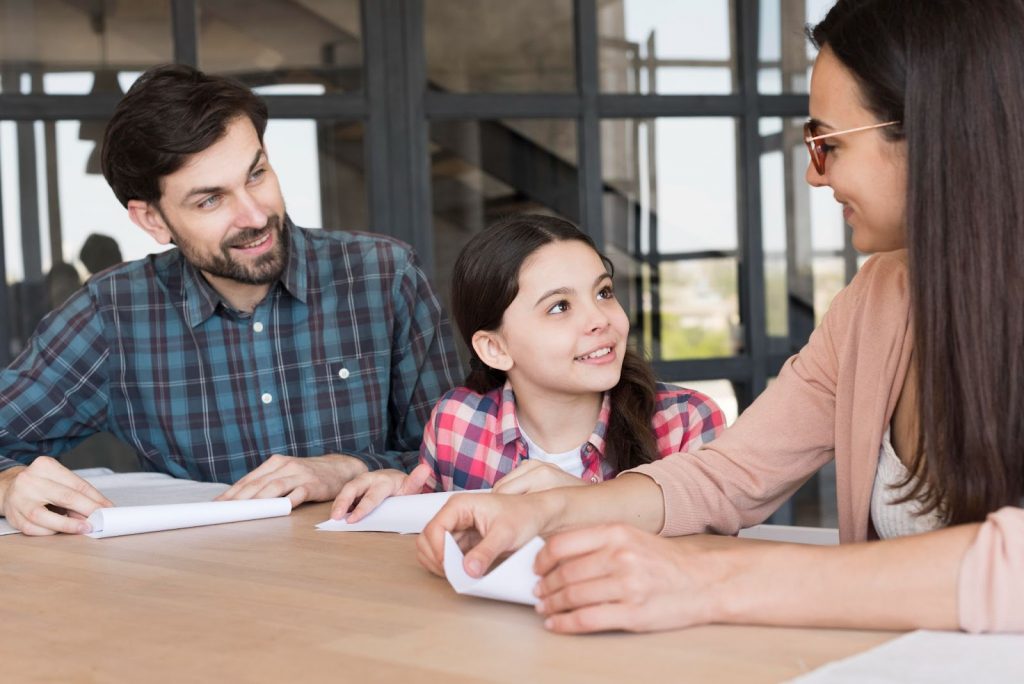 A teacher parent and child in parent teacher meeting