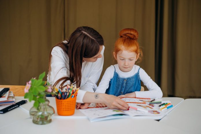 A mother teaching her kid