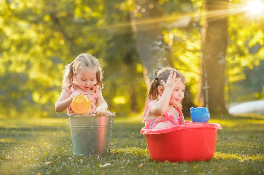 Two girls playing with water