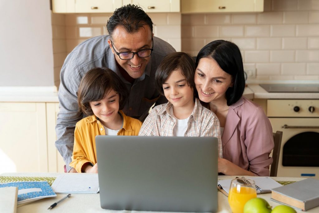 Family looking at the laptop