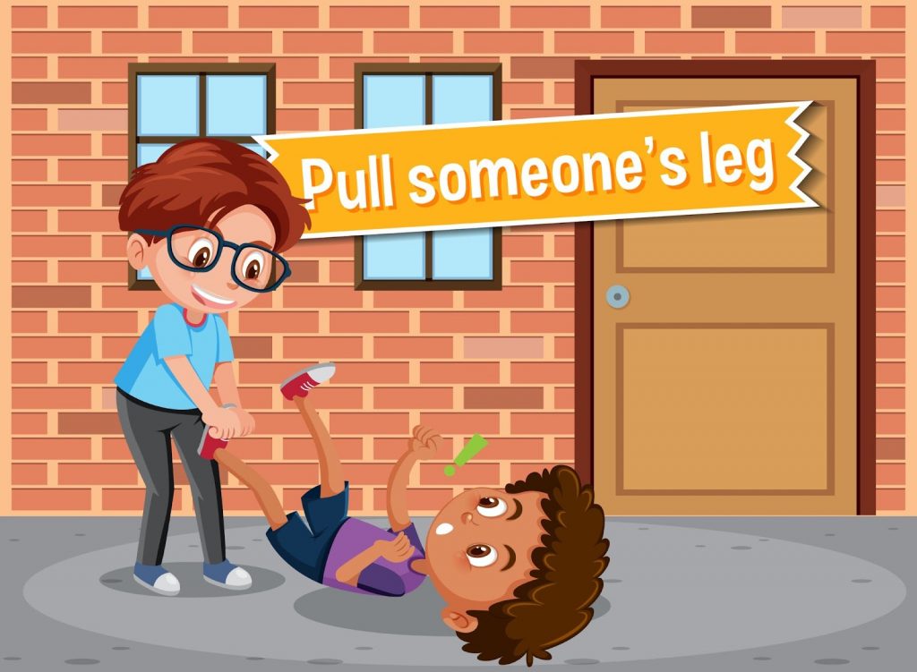 A boy pulling leg of his friend