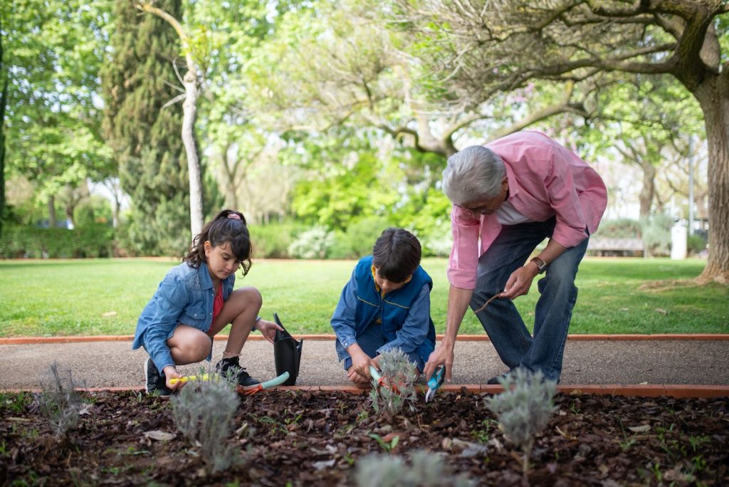 A teacher involved in gardening with his students