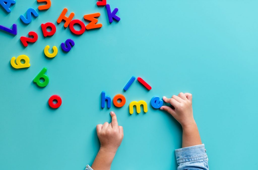 Kid arranging letters