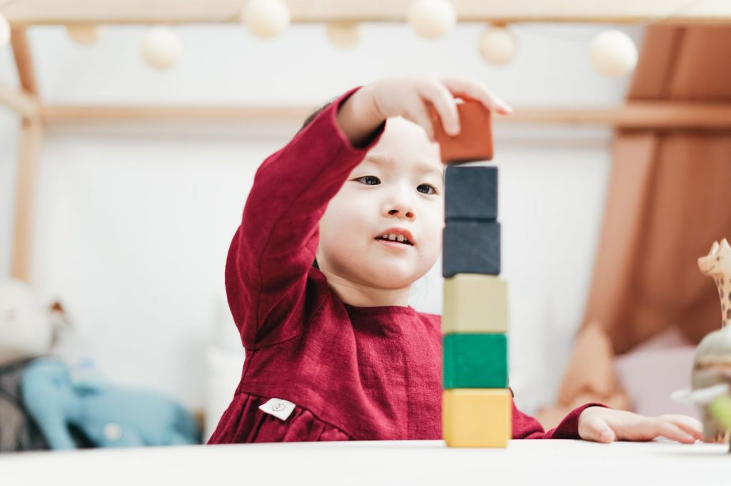 Child playing with wooden blocks