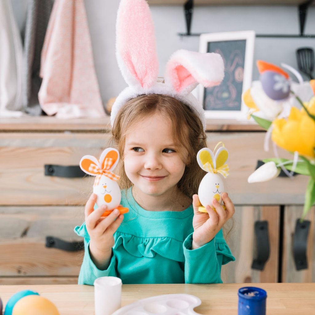 Girl holding a handmade bunny craft