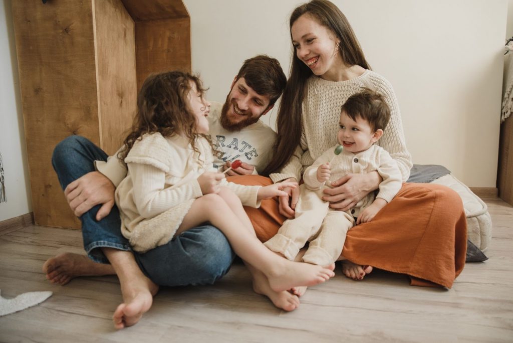 Happy family sitting and laughing