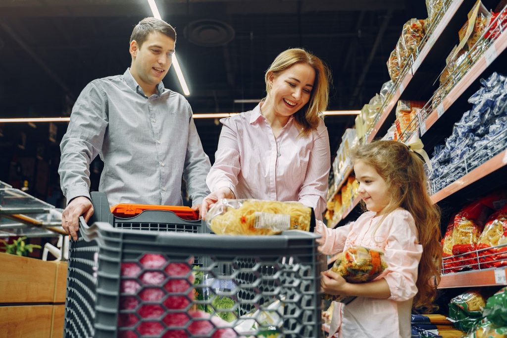 Parent and kid shopping grocery