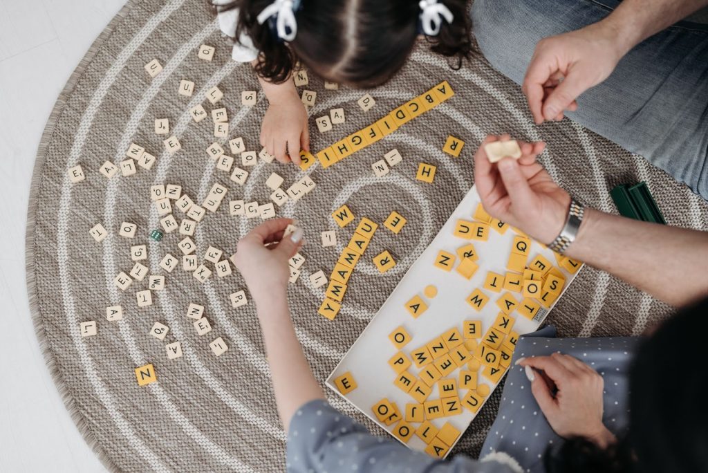 Family playing scrabble