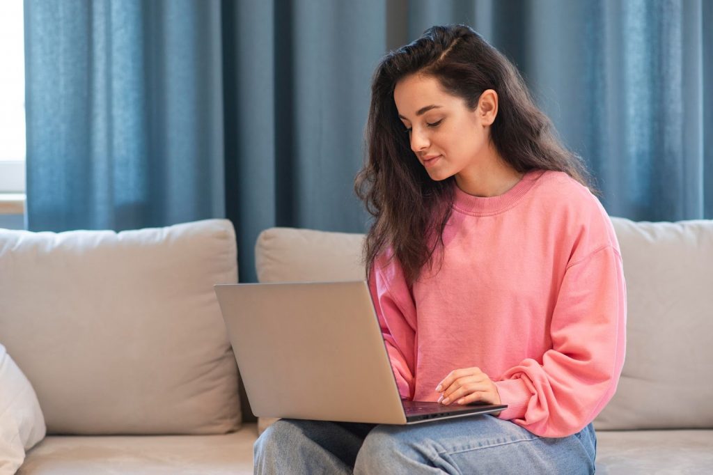 Woman browsing the laptop