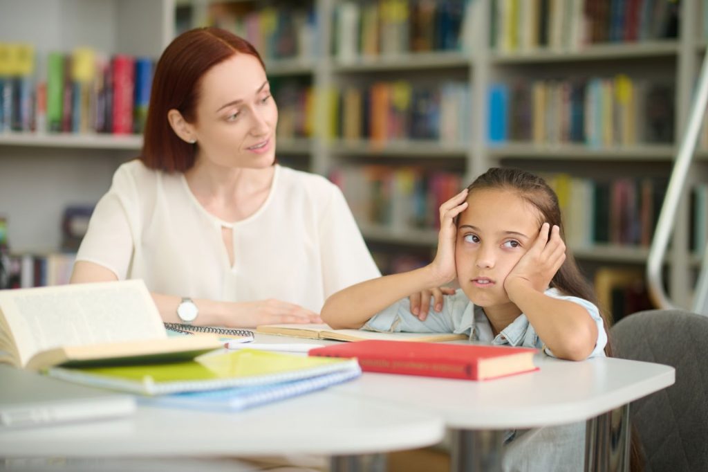 Woman looking at a child