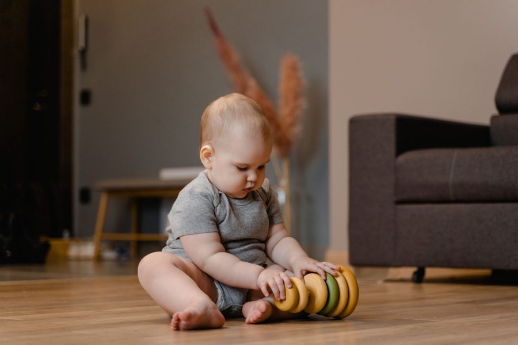 Kid playing alone with a toy