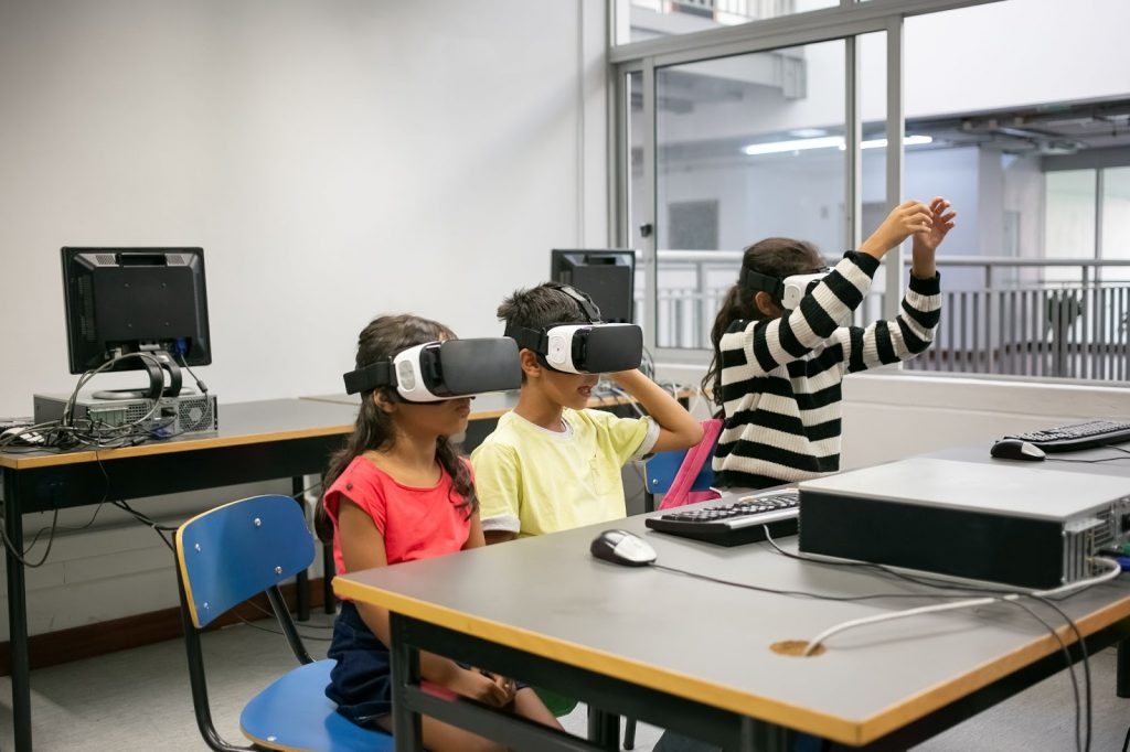 Kids using VR glasses in classroom