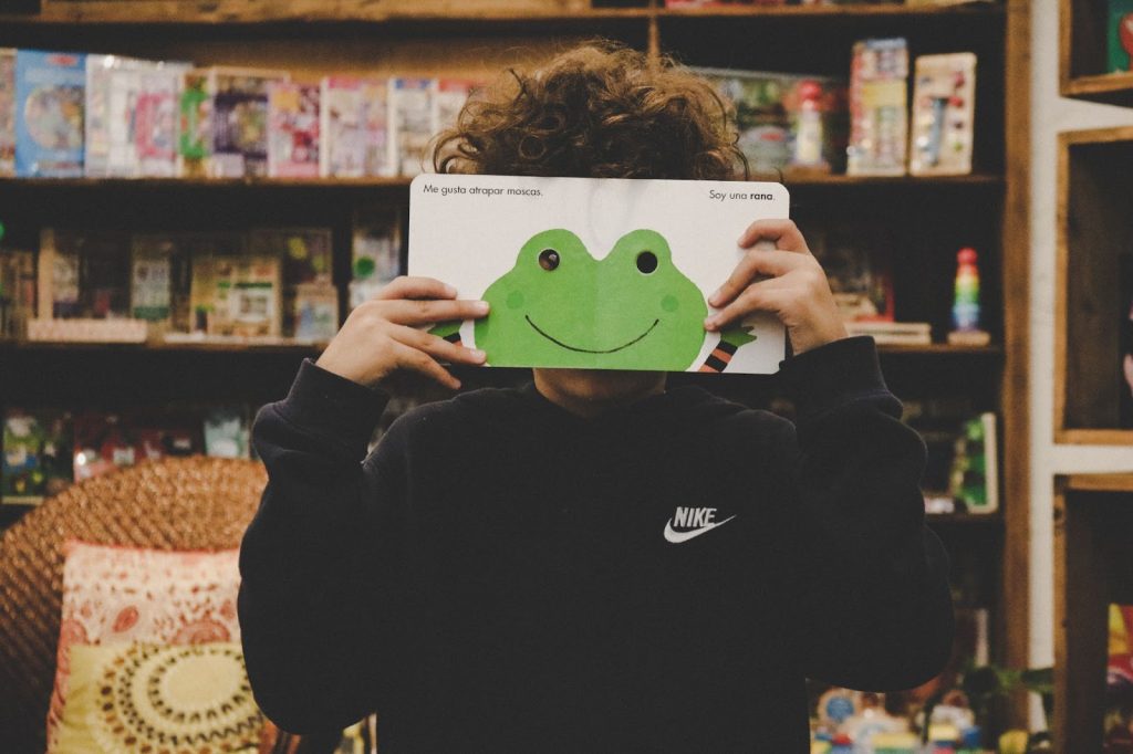 Boy with his nose in a book