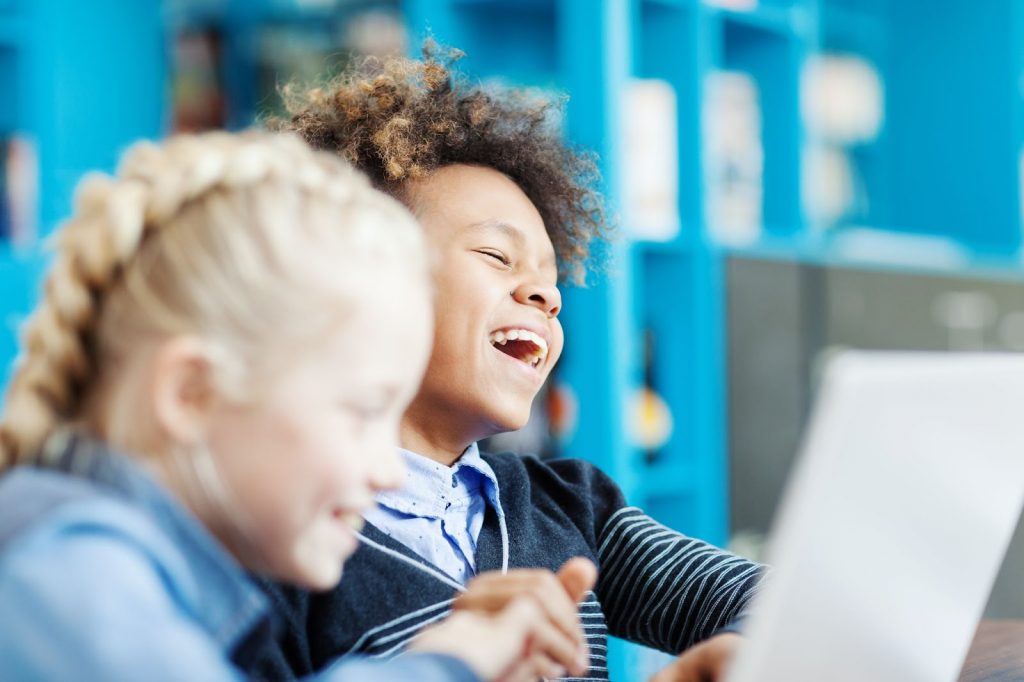 A girl laughing in class