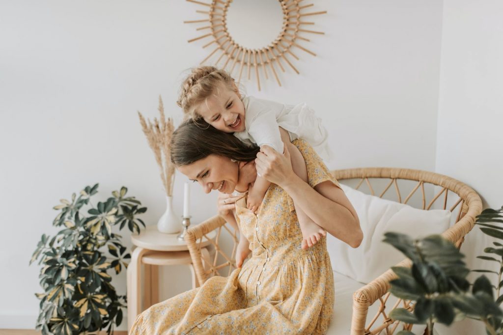 Woman with her baby girl laughing