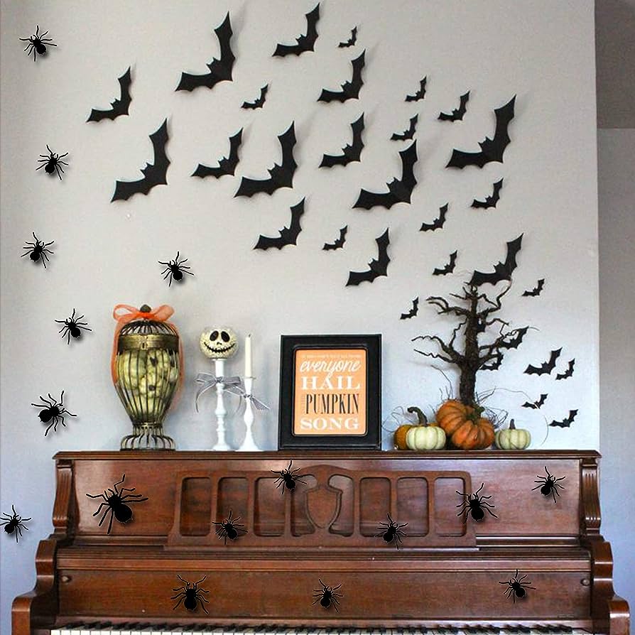 Halloween handmade decor. How to make funny paper bat. Cutting the shape  with scissors. Step 2. Top view, flat lay Stock Photo