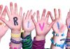 Kids hands with trivia written on them