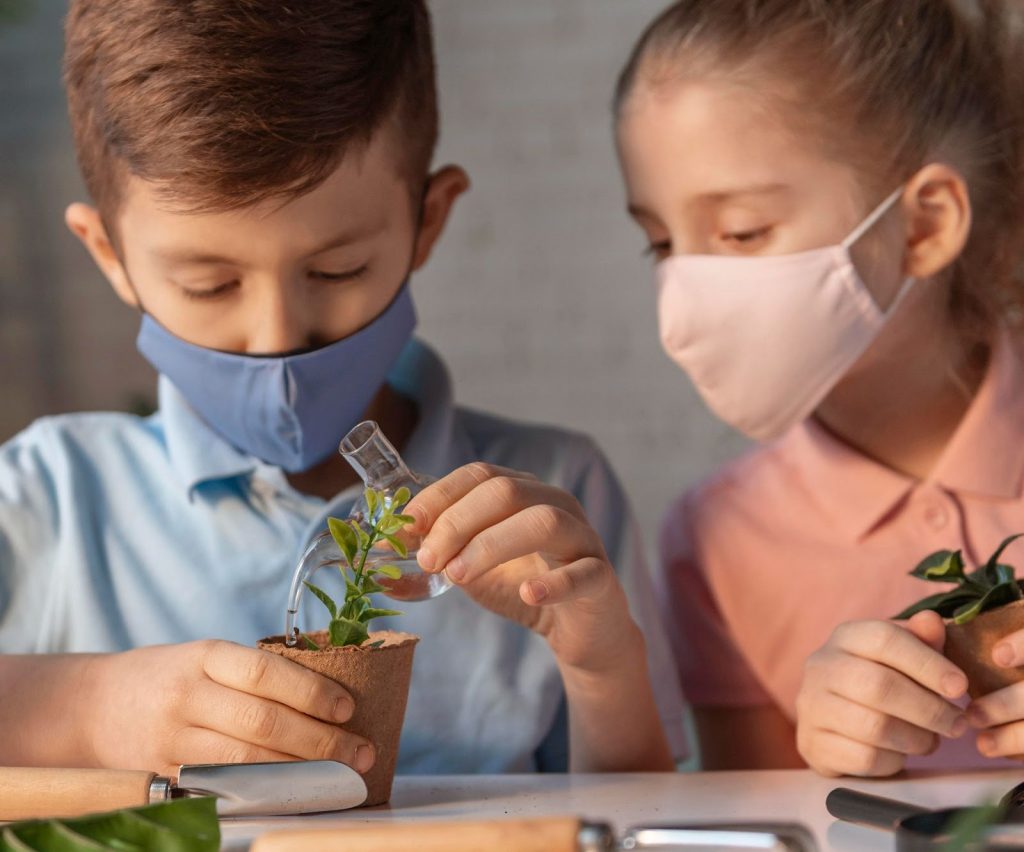 Two kids performing a science experiment