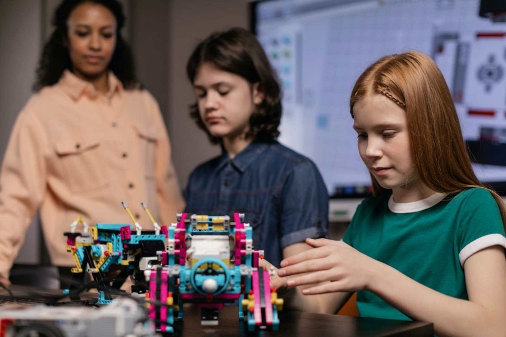 A student making a plastic robot