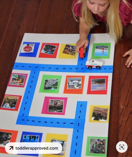 A little girl trying to build a story around a picture wall