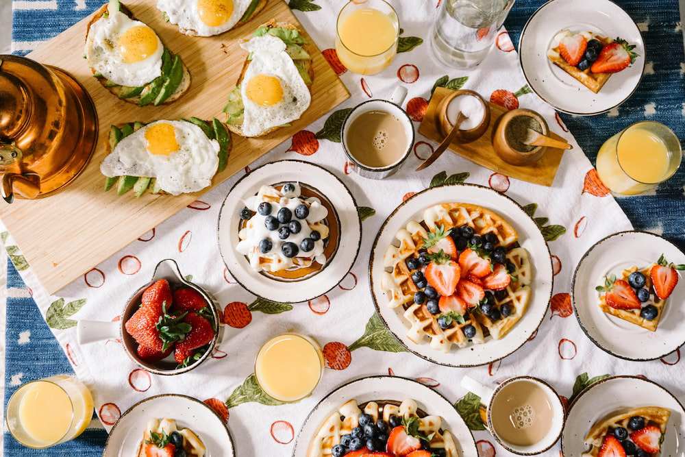 Many breakfast options laid on a table