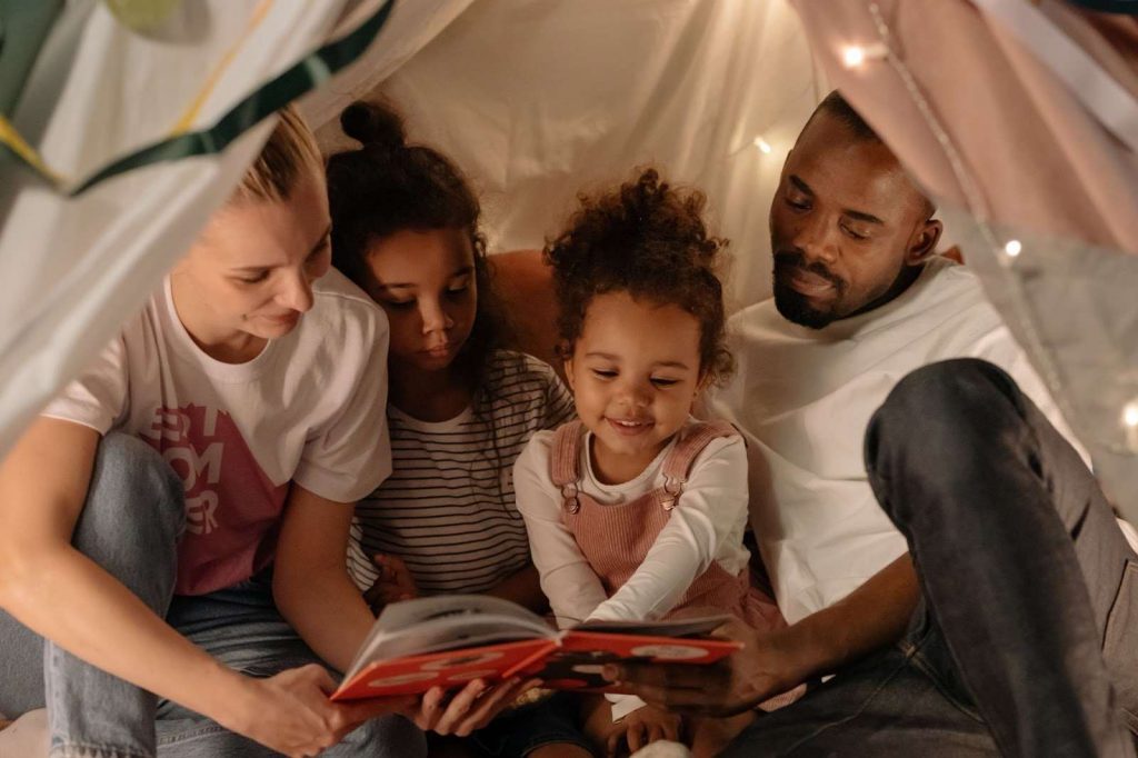 A family reading a book together