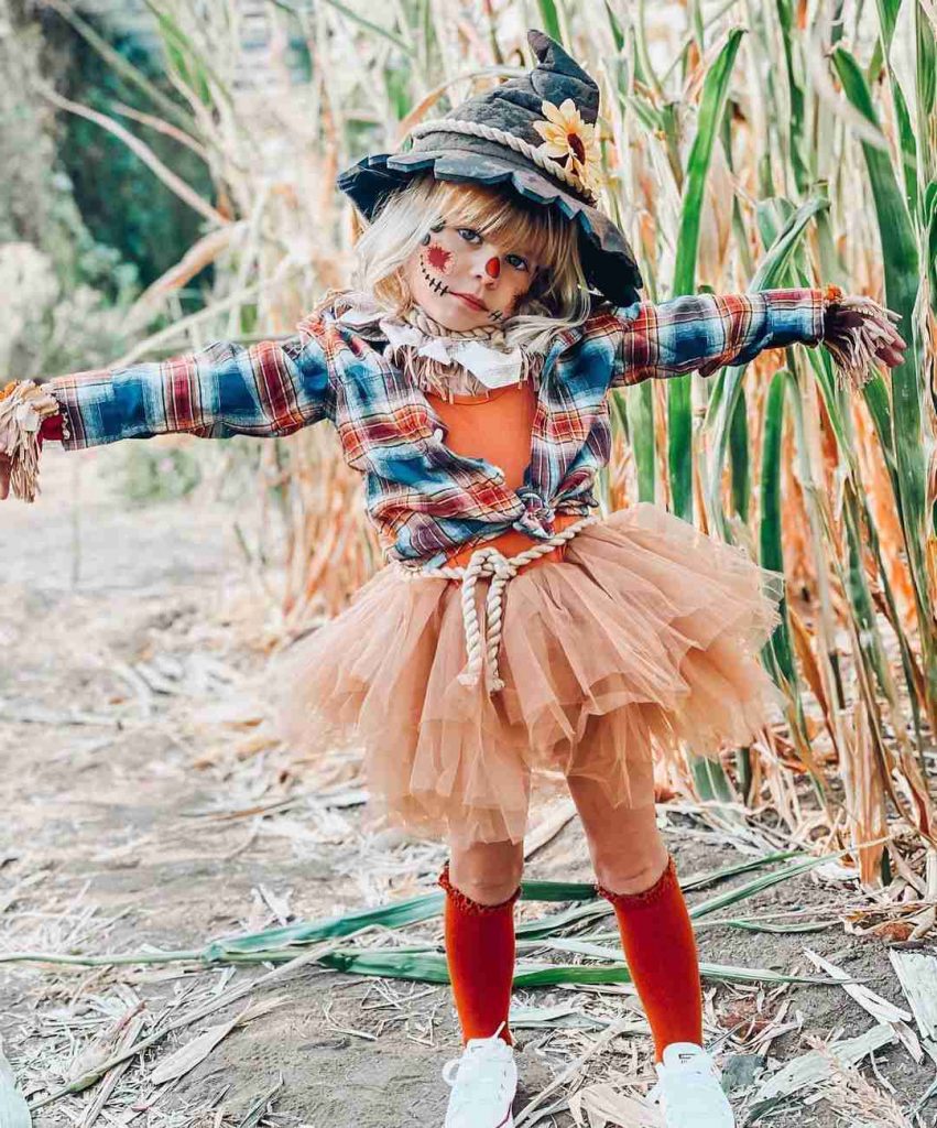 A kid in scarecrow costume