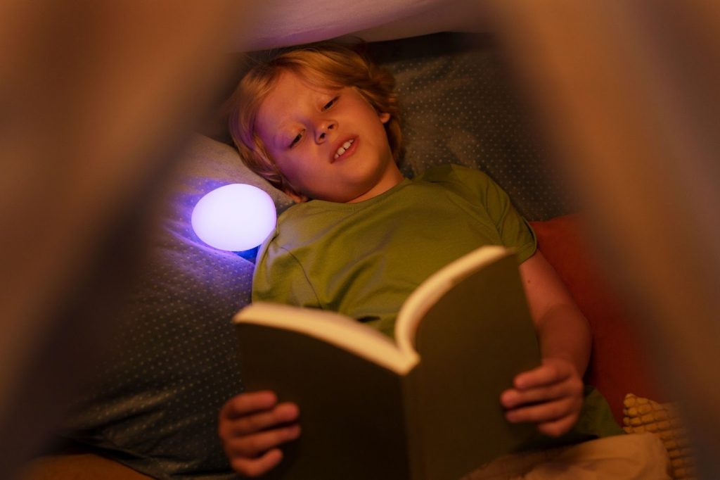 kid reading in his hideout