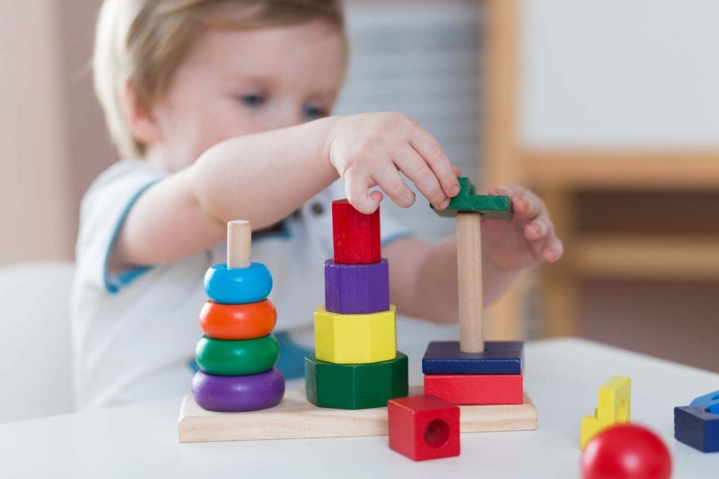 Kid sorting shapes