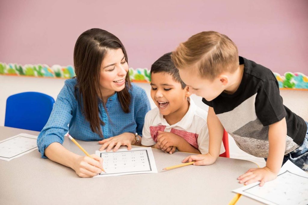 A teacher talking to kids