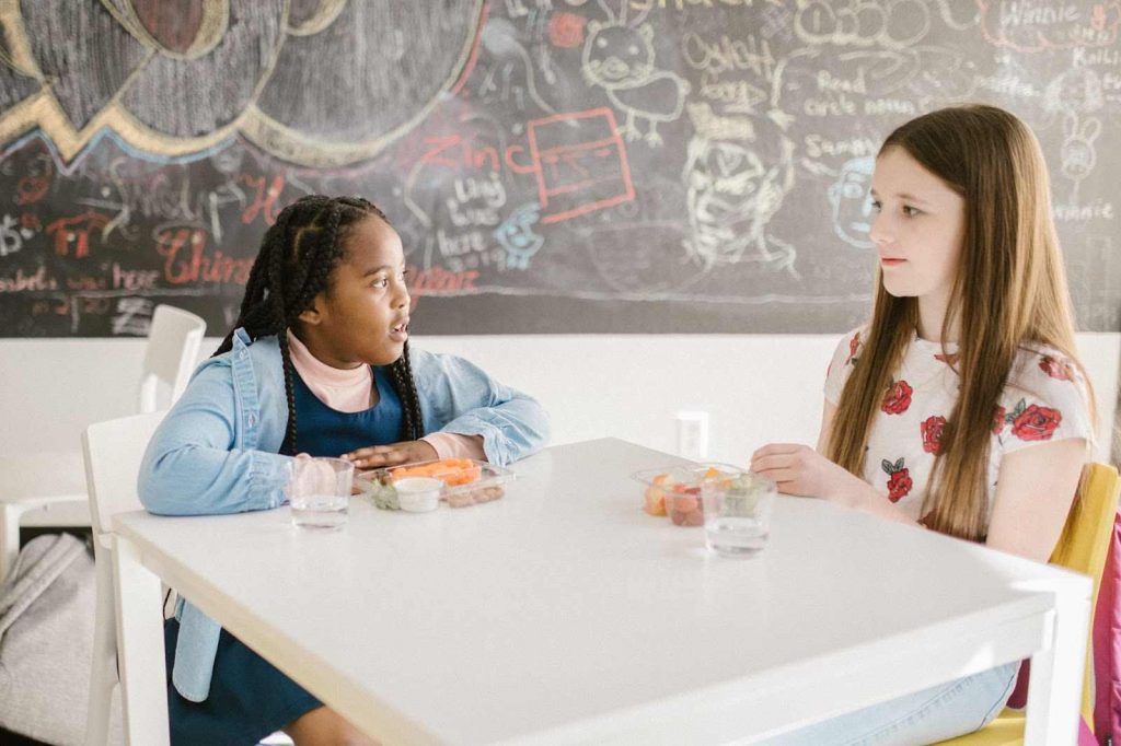 Two children discussing something